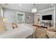 Spacious main bedroom featuring hardwood floors, chandelier, and a sitting area at 1070 Standard Ne Dr, Brookhaven, GA 30319