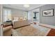 Spacious main bedroom with hardwood floors, a chandelier, and a view into an office at 1070 Standard Ne Dr, Brookhaven, GA 30319