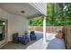 Covered patio with grill, outdoor seating, and fenced yard at 158 Bryon Ln, Acworth, GA 30102