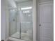 Bathroom shower with glass doors, gray tile, and a built-in bench at 158 Bryon Ln, Acworth, GA 30102
