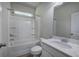 Modern bathroom featuring a shower-tub combo and vanity with a white marble countertop at 158 Bryon Ln, Acworth, GA 30102