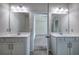 Double sink bathroom vanity with white cabinets, marble countertop, and modern fixtures at 158 Bryon Ln, Acworth, GA 30102