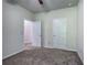 Bedroom showcasing two doors and neutral walls with carpet and ceiling fan at 158 Bryon Ln, Acworth, GA 30102