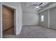 Spacious carpeted bedroom with a ceiling fan and closet at 158 Bryon Ln, Acworth, GA 30102