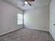 Neutral carpeted bedroom with bright window and ceiling fan at 158 Bryon Ln, Acworth, GA 30102