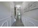 Hallway with gray wood floors, decorative moldings, and stylish wall decor that adds a touch of elegance at 158 Bryon Ln, Acworth, GA 30102