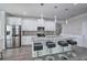 Modern kitchen featuring a granite island with seating, stainless appliances, and sleek, minimalist design at 158 Bryon Ln, Acworth, GA 30102