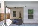 Covered patio features outdoor seating with a view of the fenced backyard at 158 Bryon Ln, Acworth, GA 30102