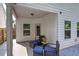 Cozy covered patio with outdoor seating and a view of the fenced backyard at 158 Bryon Ln, Acworth, GA 30102
