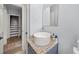 Bathroom featuring a vessel sink with granite countertop, neutral walls, and open doorway at 1649 Beecher Sw St, Atlanta, GA 30310