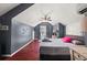 Bedroom features high ceilings, hardwood floors, and a ceiling fan at 1649 Beecher Sw St, Atlanta, GA 30310