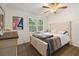 Bedroom with hardwood floors, windows, and a queen-sized bed with white bedding and light-colored frame at 1649 Beecher Sw St, Atlanta, GA 30310