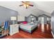 Bedroom featuring high ceilings, hardwood floors, and a ceiling fan at 1649 Beecher Sw St, Atlanta, GA 30310