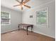 Bright bedroom with hardwood floors, windows, and space for a desk or seating area at 1649 Beecher Sw St, Atlanta, GA 30310