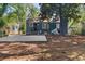 Exterior view of home with a large concrete patio in the back at 1649 Beecher Sw St, Atlanta, GA 30310