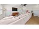 Bright living room featuring a large sectional sofa, hardwood floors, and stylish decor at 1649 Beecher Sw St, Atlanta, GA 30310