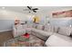 Living room with large sectional, a decorative rug, and bright accents at 1649 Beecher Sw St, Atlanta, GA 30310
