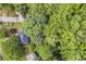 Aerial view of a house surrounded by lush greenery and trees at 1867 N Creek Cir, Alpharetta, GA 30009