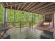 Inviting back deck overlooking a lush backyard with stairs leading to playhouse at 1867 N Creek Cir, Alpharetta, GA 30009