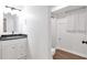 Bathroom with granite countertop, modern vanity, and a shower-tub combo at 1867 N Creek Cir, Alpharetta, GA 30009