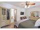 Well-lit bedroom featuring large storage closet, neutral paint, and view into the bathroom at 1867 N Creek Cir, Alpharetta, GA 30009