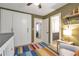 Bright bedroom features a closet, neutral walls and a playful colorful rug at 1867 N Creek Cir, Alpharetta, GA 30009