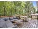 Spacious deck with outdoor seating surrounded by lush greenery offers a tranquil retreat at 1867 N Creek Cir, Alpharetta, GA 30009