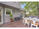 Large wooden deck with outdoor seating and grill, perfect for entertaining at 1867 N Creek Cir, Alpharetta, GA 30009