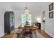 Elegant dining room with wood floors, a large table, and natural light, perfect for entertaining at 1867 N Creek Cir, Alpharetta, GA 30009