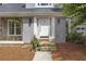 Close up of a home's front entrance, featuring a stone pathway and beautifully detailed white door at 1867 N Creek Cir, Alpharetta, GA 30009