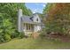 Charming home exterior featuring stone accents and a well-manicured lawn at 1867 N Creek Cir, Alpharetta, GA 30009