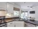 Well lit kitchen with stainless steel appliances, granite counters and breakfast nook at 1867 N Creek Cir, Alpharetta, GA 30009