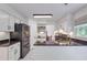 Modern kitchen with white cabinets, black countertops, and stainless steel appliances at 1867 N Creek Cir, Alpharetta, GA 30009