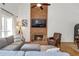 Comfortable living room with brick fireplace, large windows, and stylish decor at 1867 N Creek Cir, Alpharetta, GA 30009
