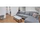 Cozy living room with plush seating, light hardwood floors, and modern decor at 1867 N Creek Cir, Alpharetta, GA 30009
