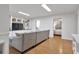 Spacious living area with built-in shelves, TV, and wood floors at 1867 N Creek Cir, Alpharetta, GA 30009