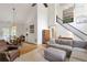 Open-concept living area featuring hardwood floors, high ceilings, and abundant natural light at 1867 N Creek Cir, Alpharetta, GA 30009