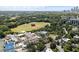 Wide aerial view featuring expansive green fields, tennis courts, a swimming pool, and buildings at 281 15Th Ne St # 202, Atlanta, GA 30309