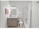 Bright bathroom featuring white subway tile, a gray vanity, and a shower-tub combination at 281 15Th Ne St # 202, Atlanta, GA 30309