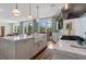 Spacious kitchen featuring stone countertops, stainless appliances, and a farmhouse sink with great natural light at 281 15Th Ne St # 202, Atlanta, GA 30309