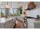Bright kitchen featuring stone countertops, stainless appliances, and large windows with natural light at 281 15Th Ne St # 202, Atlanta, GA 30309