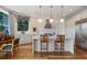Elegant kitchen boasts stone countertops, stainless steel appliances, island seating and hardwood floors at 281 15Th Ne St # 202, Atlanta, GA 30309