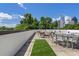 Rooftop deck with lounge chairs, tables, and city skyline views, perfect for outdoor entertaining at 281 15Th Ne St # 202, Atlanta, GA 30309