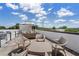 Relaxing rooftop deck featuring stylish outdoor furniture, ideal for enjoying city views and sunshine at 281 15Th Ne St # 202, Atlanta, GA 30309