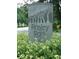 A decorative 'Ansley Park' sign is surrounded by flowers, marking the entrance to the neighborhood at 281 15Th Ne St # 202, Atlanta, GA 30309