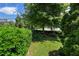 A quaint backyard featuring well-maintained green grass and trimmed bushes, offering a private outdoor space at 281 15Th Ne St # 202, Atlanta, GA 30309