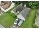 Overhead shot of a cozy single-Gathering home in a suburban setting with green lawns at 1394 Isleworth Cir, Atlanta, GA 30349