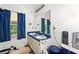 Bathroom with double sinks, a large mirror, and blue accents at 1394 Isleworth Cir, Atlanta, GA 30349