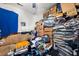 Bedroom cluttered with boxes and belongings, blue blanket and dark carpet at 1394 Isleworth Cir, Atlanta, GA 30349
