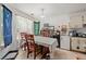 Cozy dining area, adjoining kitchen, with a wooden table set for meals at 1394 Isleworth Cir, Atlanta, GA 30349